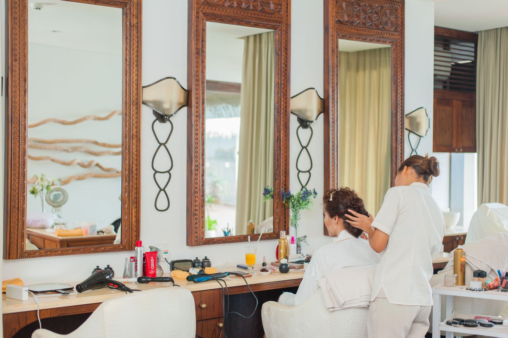 Barber cutting a client's hair in a moody barbershop